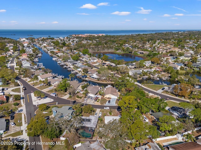 birds eye view of property featuring a residential view and a water view