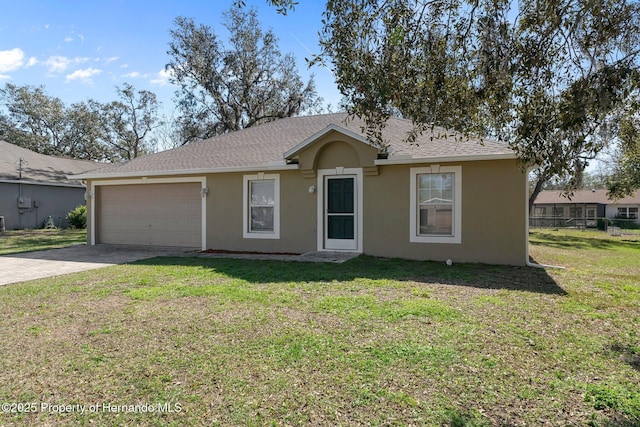 ranch-style house with driveway, a front yard, and stucco siding