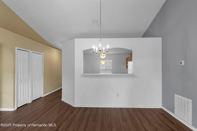 unfurnished dining area with a chandelier, lofted ceiling, visible vents, and wood finished floors