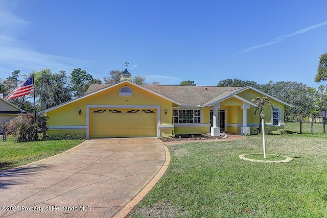 view of front of property with an attached garage, a shingled roof, concrete driveway, stucco siding, and a front yard