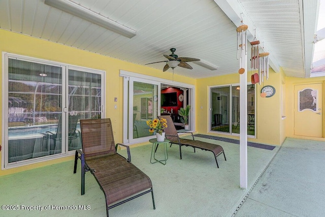 view of patio featuring ceiling fan