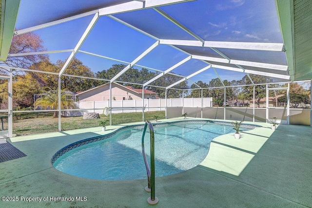 view of swimming pool with a fenced in pool, fence private yard, a lanai, and a patio area