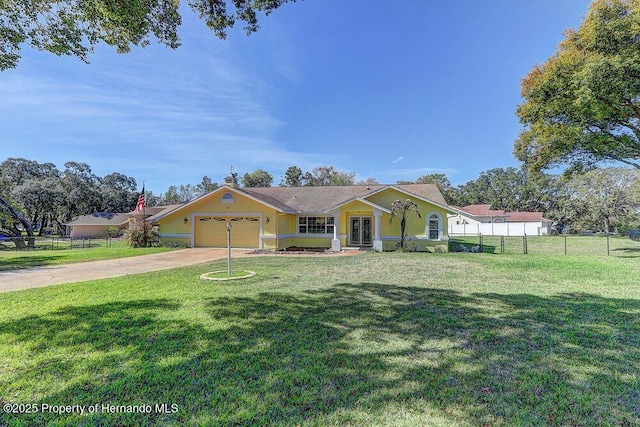 view of front of house with driveway, a front lawn, and fence