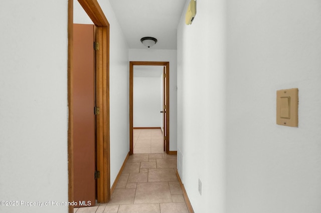 hall featuring baseboards