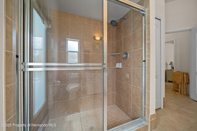 bathroom featuring a stall shower and tile patterned floors