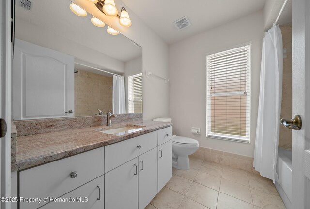 full bathroom with visible vents, vanity, toilet, and tile patterned floors