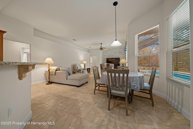 dining room with visible vents, ceiling fan, baseboards, and light tile patterned floors