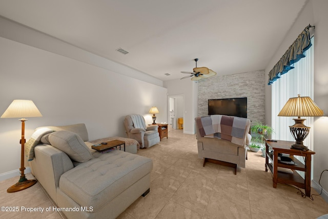 sitting room featuring ceiling fan, visible vents, and baseboards