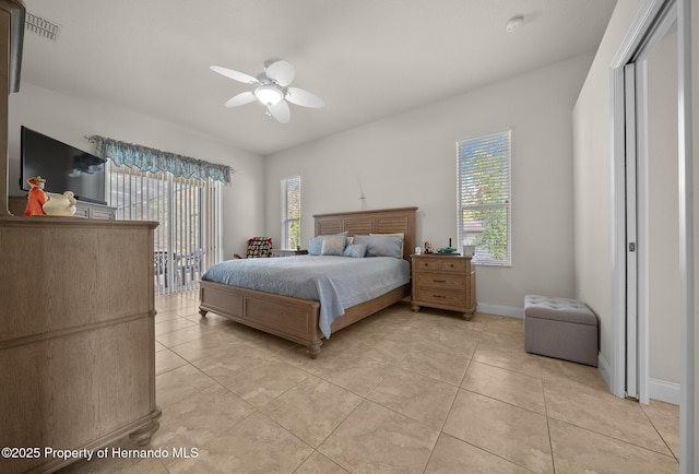 bedroom featuring access to exterior, visible vents, baseboards, and light tile patterned flooring