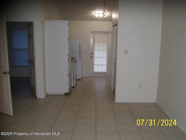 hallway with light tile patterned floors