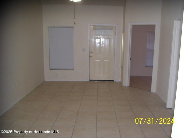 entryway with light tile patterned floors