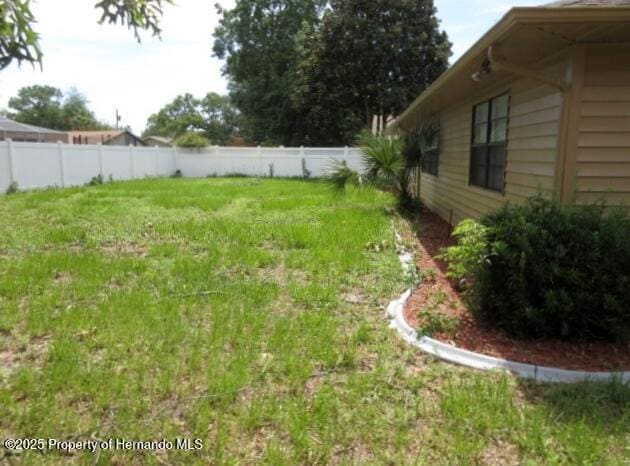 view of yard featuring fence