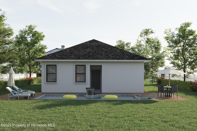 back of property featuring a yard, a patio area, stucco siding, and fence