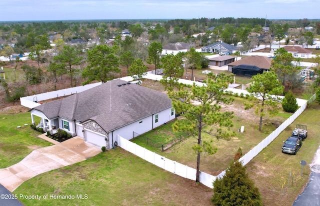 birds eye view of property with a residential view