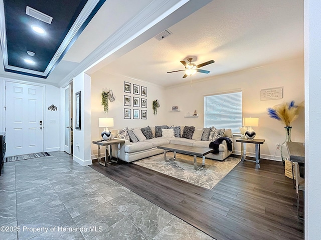 living room with dark wood-style floors, ornamental molding, and visible vents