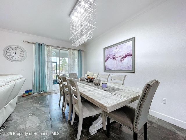 dining space featuring ornamental molding, an inviting chandelier, and baseboards