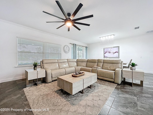 living area featuring baseboards, visible vents, and crown molding