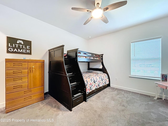 bedroom featuring a ceiling fan, baseboards, and carpet flooring