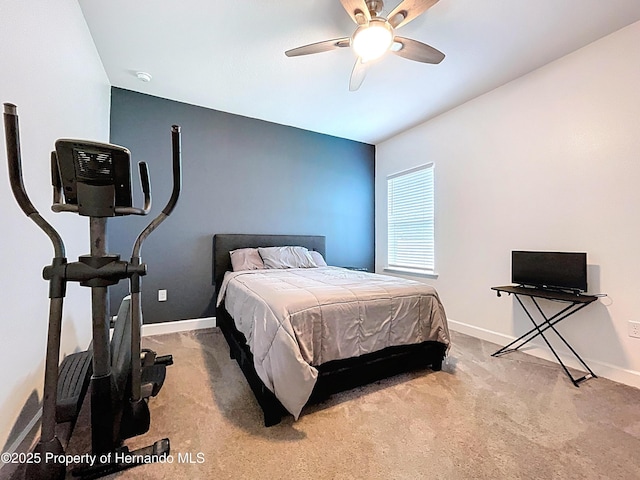 bedroom featuring carpet floors, baseboards, and a ceiling fan