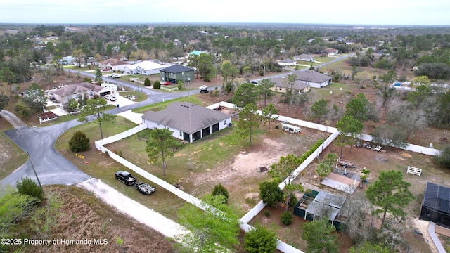 birds eye view of property with a residential view