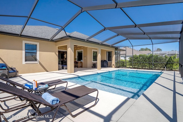 pool with a patio and a lanai