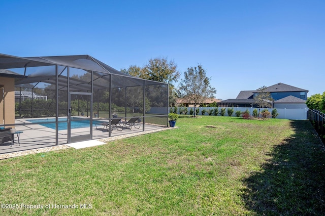 view of yard featuring a patio, a fenced backyard, a fenced in pool, and a lanai