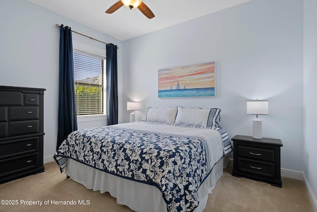 bedroom with light carpet, ceiling fan, and baseboards