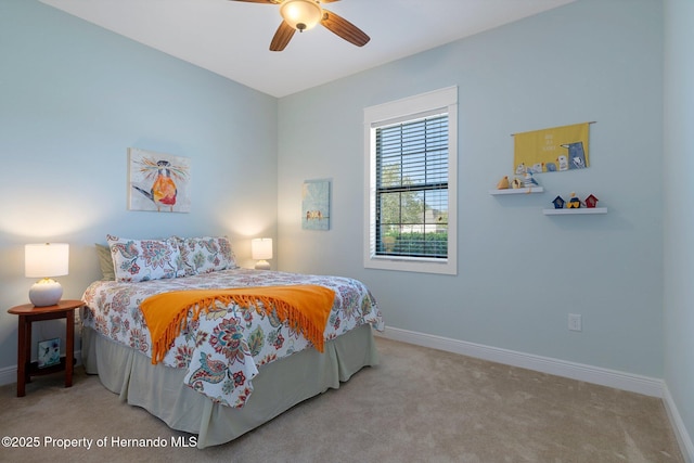 bedroom with carpet floors, ceiling fan, and baseboards