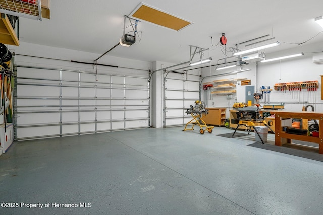 garage with a garage door opener and electric panel