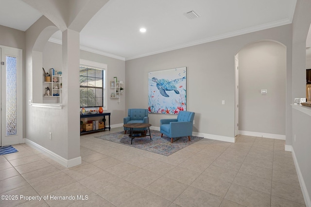 sitting room with visible vents, crown molding, baseboards, and light tile patterned flooring