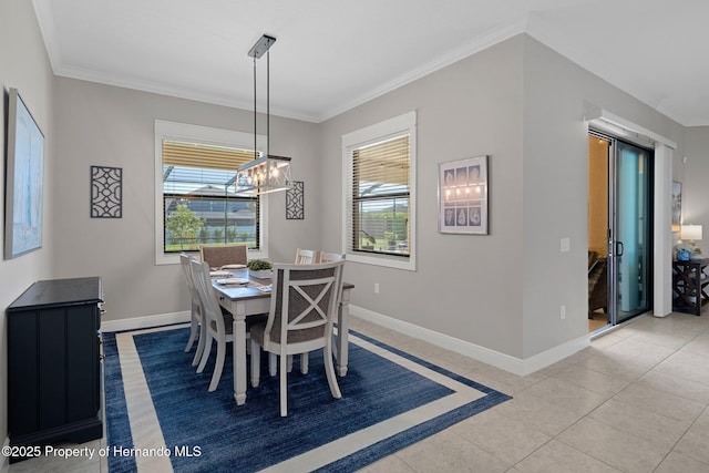 dining area featuring a healthy amount of sunlight, light tile patterned floors, baseboards, and ornamental molding