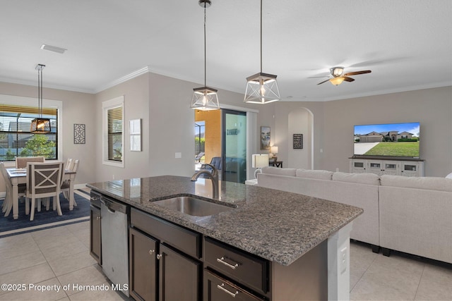 kitchen featuring arched walkways, light tile patterned flooring, a sink, stainless steel dishwasher, and crown molding