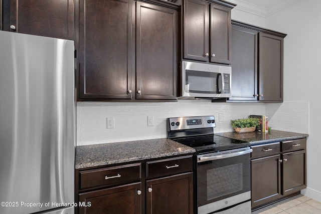 kitchen with stainless steel appliances, dark brown cabinetry, and tasteful backsplash