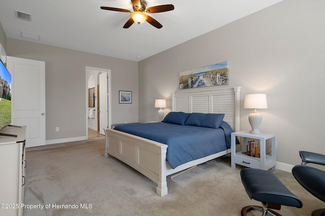 bedroom featuring light carpet, visible vents, and baseboards