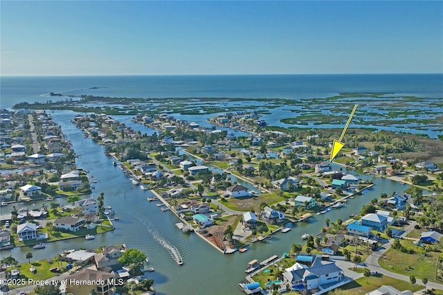 drone / aerial view featuring a water view and a residential view