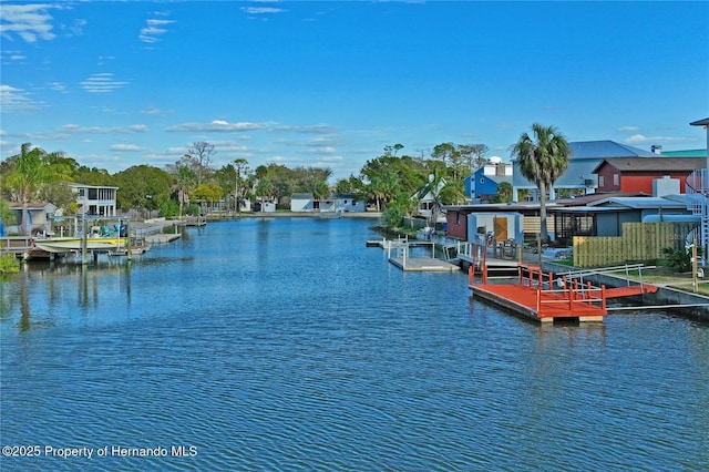 dock area with a water view and a residential view