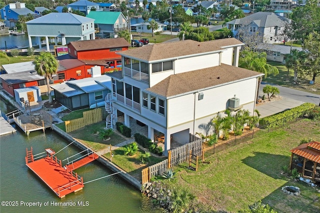 bird's eye view featuring a residential view and a water view