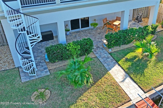 view of yard with a patio and stairs