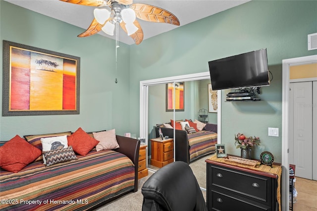 bedroom with visible vents, a closet, and a ceiling fan