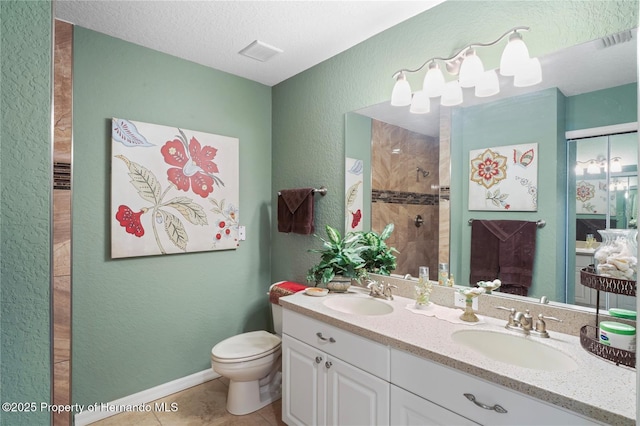 full bathroom with toilet, visible vents, a sink, and tiled shower