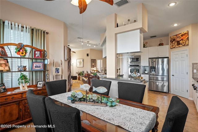 dining space featuring light tile patterned floors, ceiling fan, recessed lighting, visible vents, and a wealth of natural light