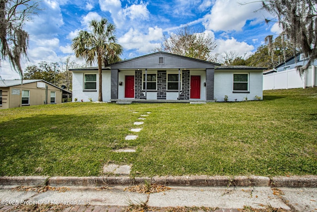 view of front of house featuring a front yard and fence