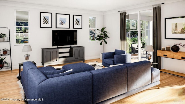 living room with light wood-style flooring, baseboards, and ornamental molding