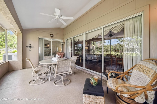 sunroom / solarium featuring lofted ceiling and ceiling fan