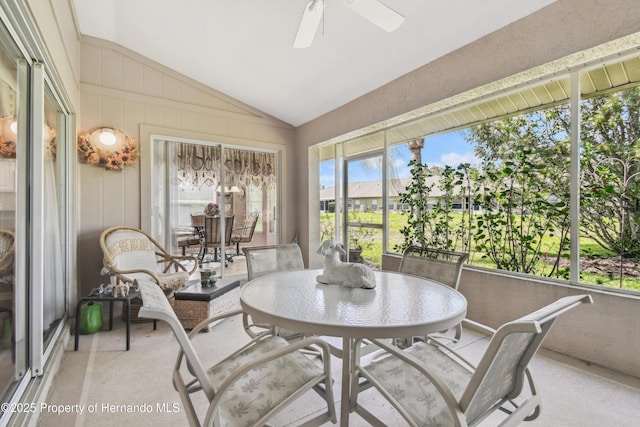 sunroom featuring vaulted ceiling and ceiling fan