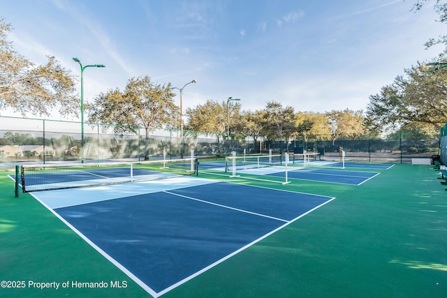 view of sport court with fence