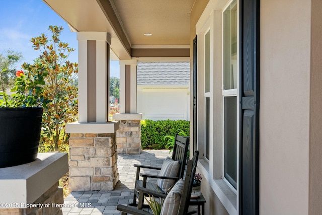 view of patio featuring a porch