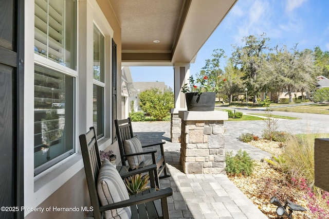 view of patio featuring a porch