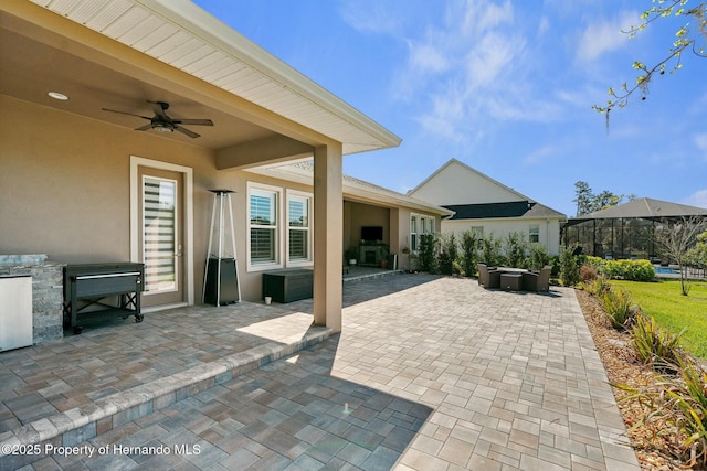 view of patio with ceiling fan