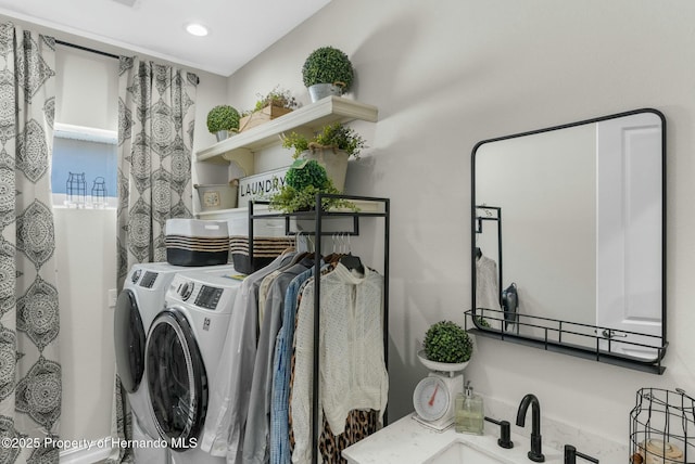 clothes washing area featuring laundry area, recessed lighting, a sink, and washer and dryer